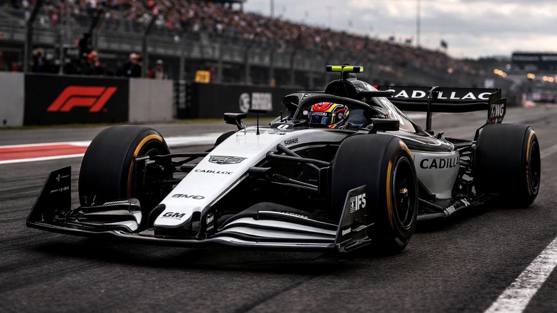 Cadillac Formula 1 car on wet track during race weekend